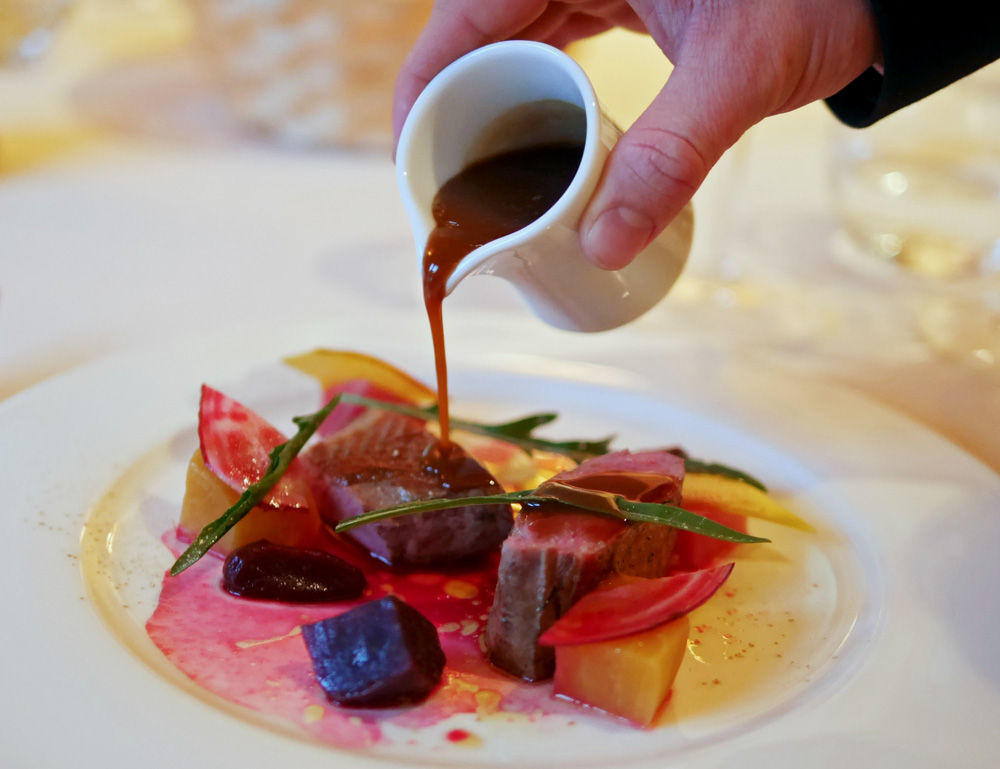 Duck cooked over pine served