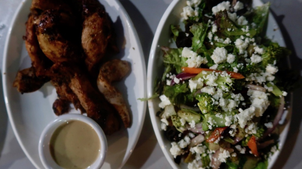 Sand Dollar Café Jerk chicken and salad. pg