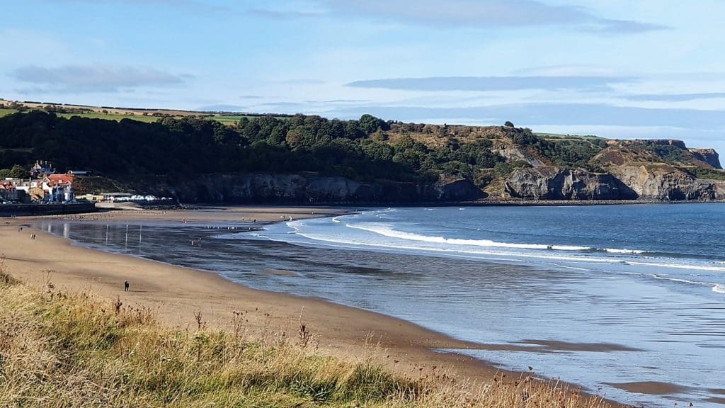 View of the bay, beach and cliffs at Sandsend East Yorkshire