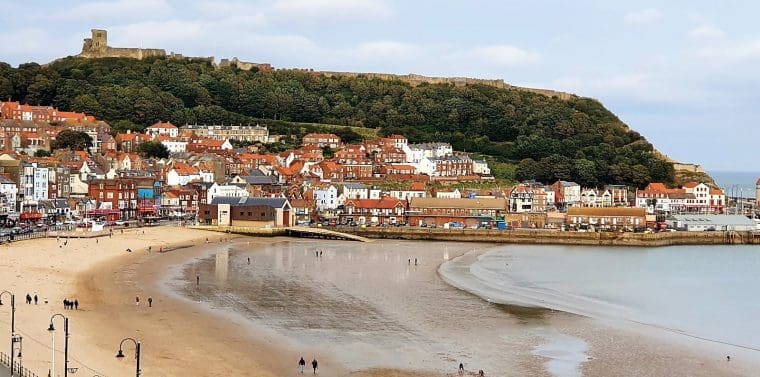 View of Scarborough bay with castle on the hill