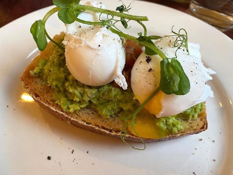 Plate of smashed peas and poached eggs at Raithwaite Sandsend