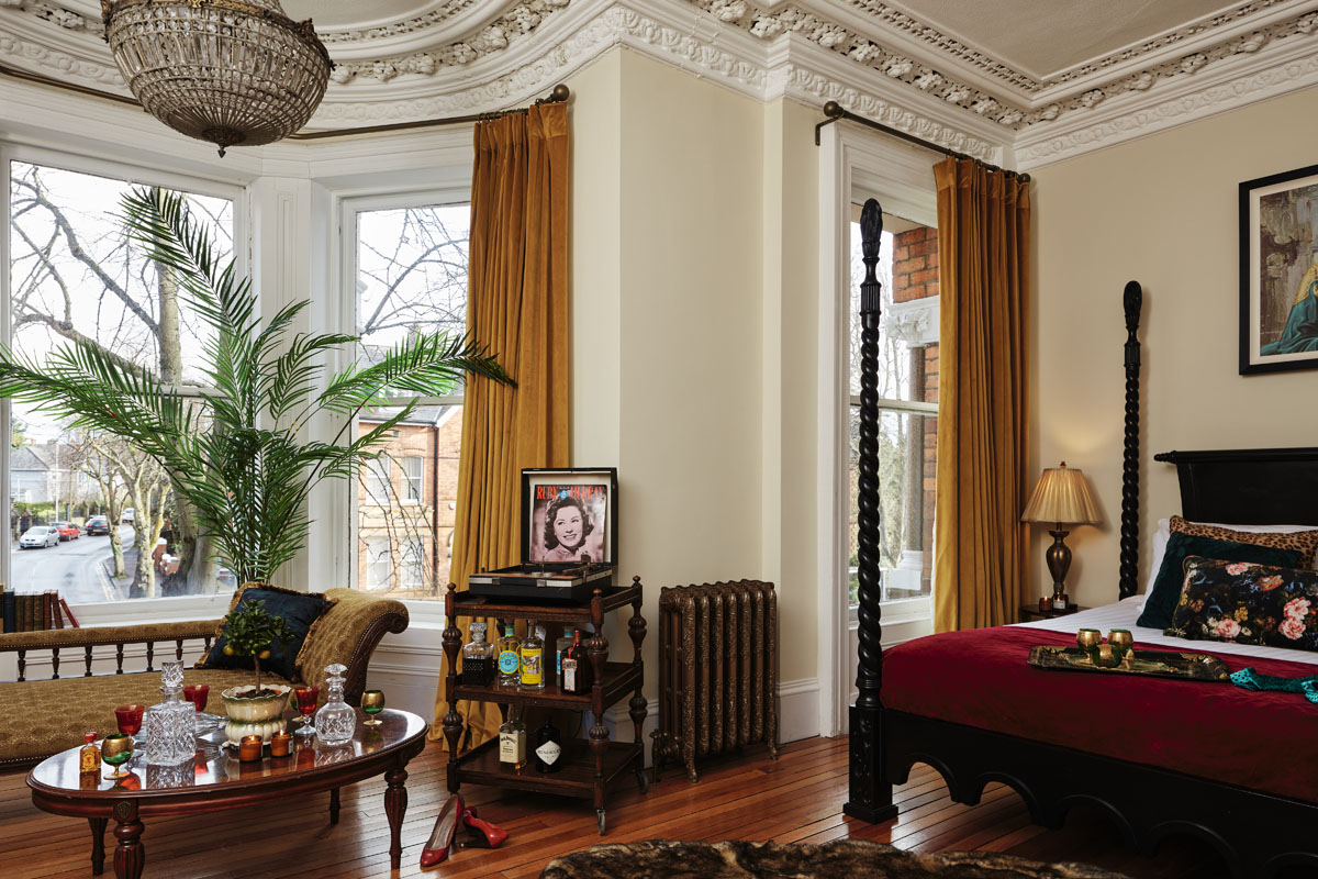 Bedroom,coffe table,drinks,music,plant,bed,lounge,curtains,architrave,lighting