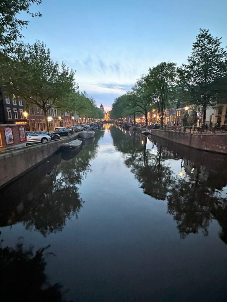 SUnset over Amsterdam canal near NH Collection Amsterdam Flower Market