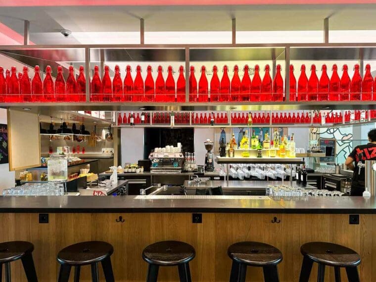 The 24/7 bar at citizenM Amstel Amsterdam hotel serves food and drinks around the clock