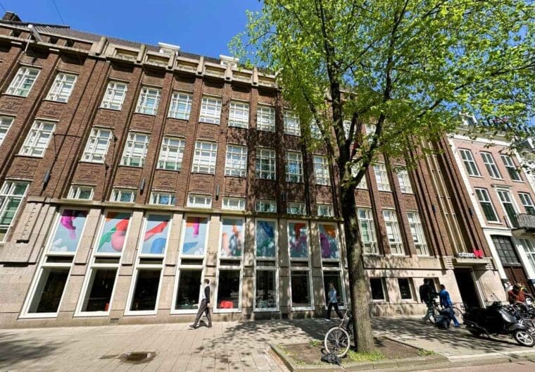Exterior of citizenM Amstel Amsterdam hotel with windows onto the street