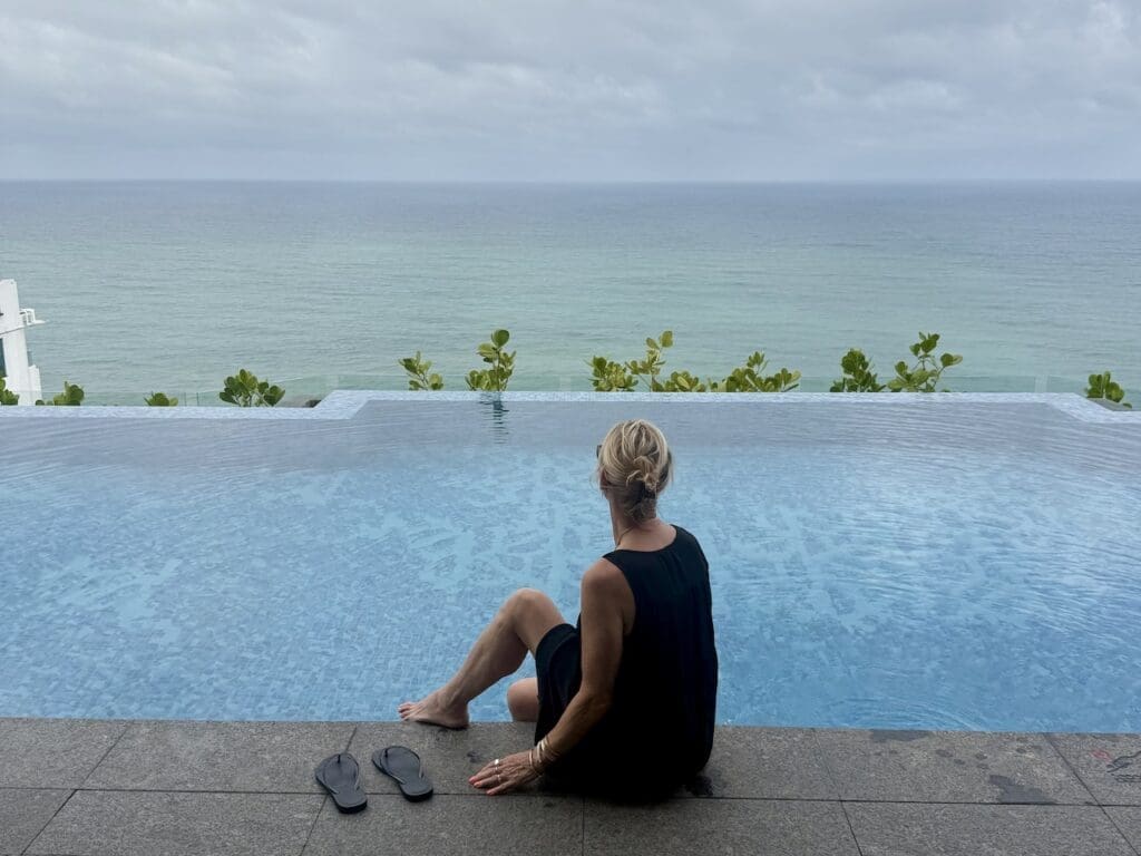 Sitting by the infinity pool at Amari Colombo