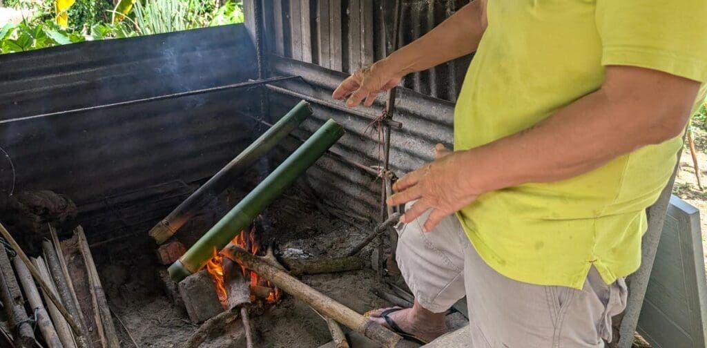 Cooking Bamboo Chicken on an opera Fire