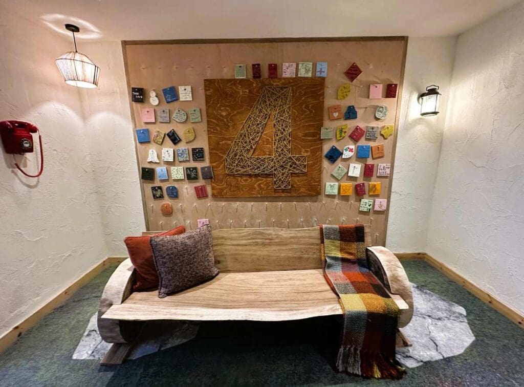 Treehouse Manchester has wooden benches and peg boards with handwritten tiles on every floor.