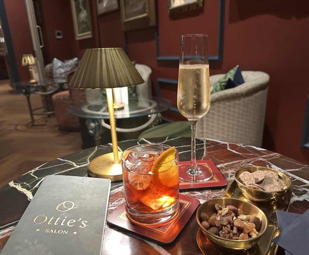 Evening drinks in Ottie's Salon at Bertrand's Townhouse