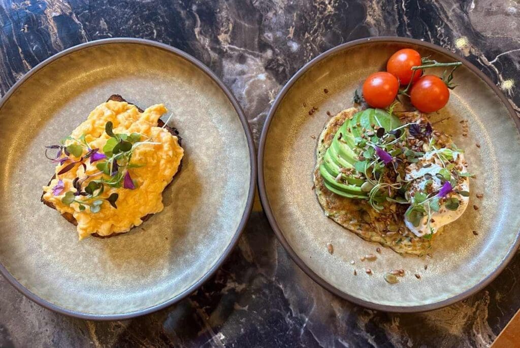 Bertrand's Townhouse truffled scrambled eggs and courgette pancake with poached egg, avocado adn toasted seeds