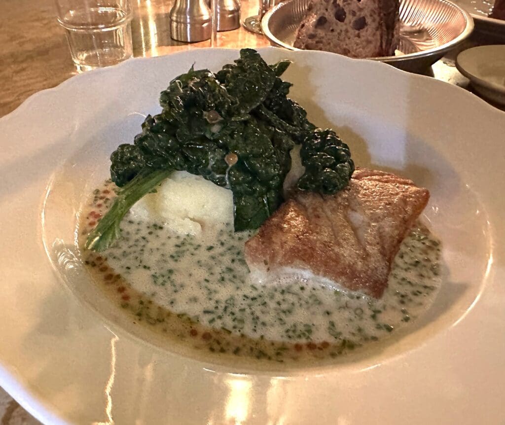 Olise restaurant pan fried cod with potato puree, Tuscan kale and trout roe