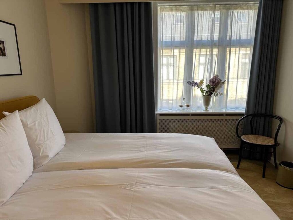 Coco Hotel double room is simply decorated in shades of ochre and blue