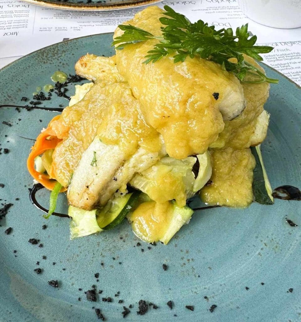 Grilled black scabbard fish with fruit sauce in Monte, Madeira